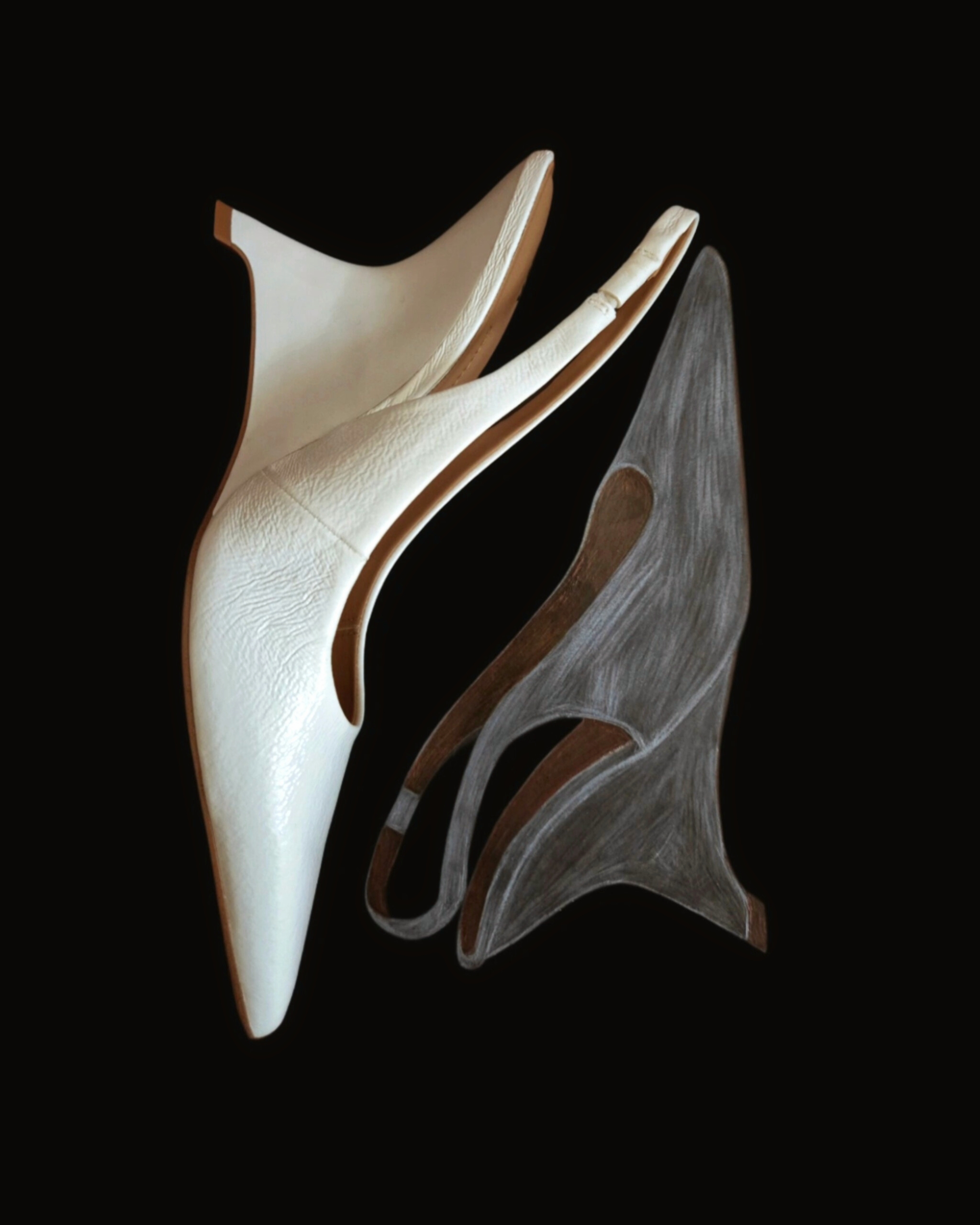 A white heel placed above a hand-drawn illustration of the same shoe on a black background, creating a visual dialogue between object and drawing.
