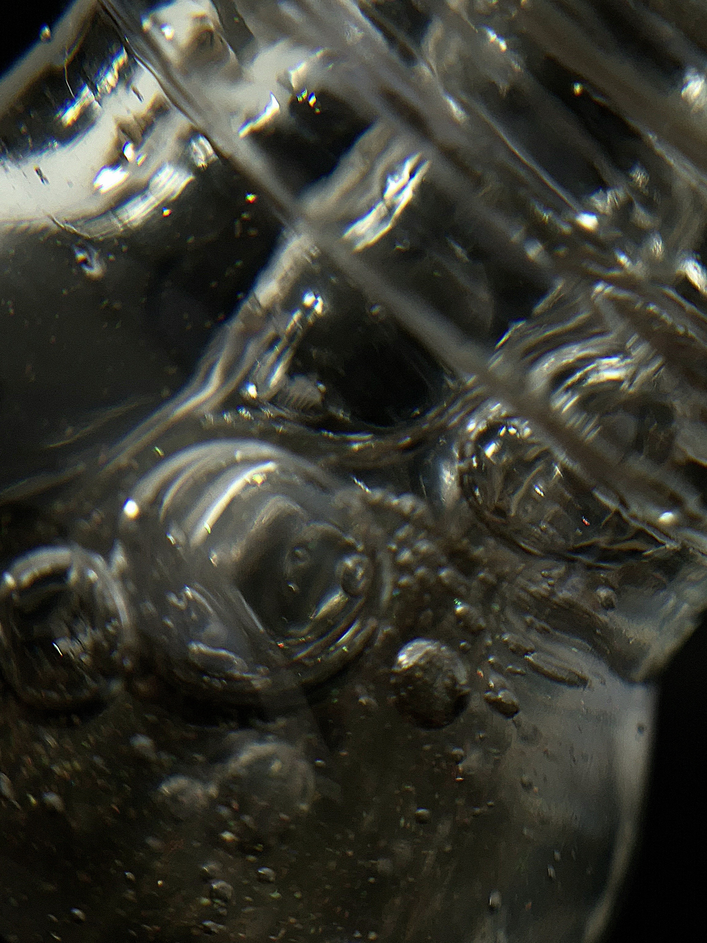 Macro shot of bubbles suspended in the serum’s liquid texture.
